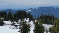 Distant view of the snow-capped Mt. Hood peak